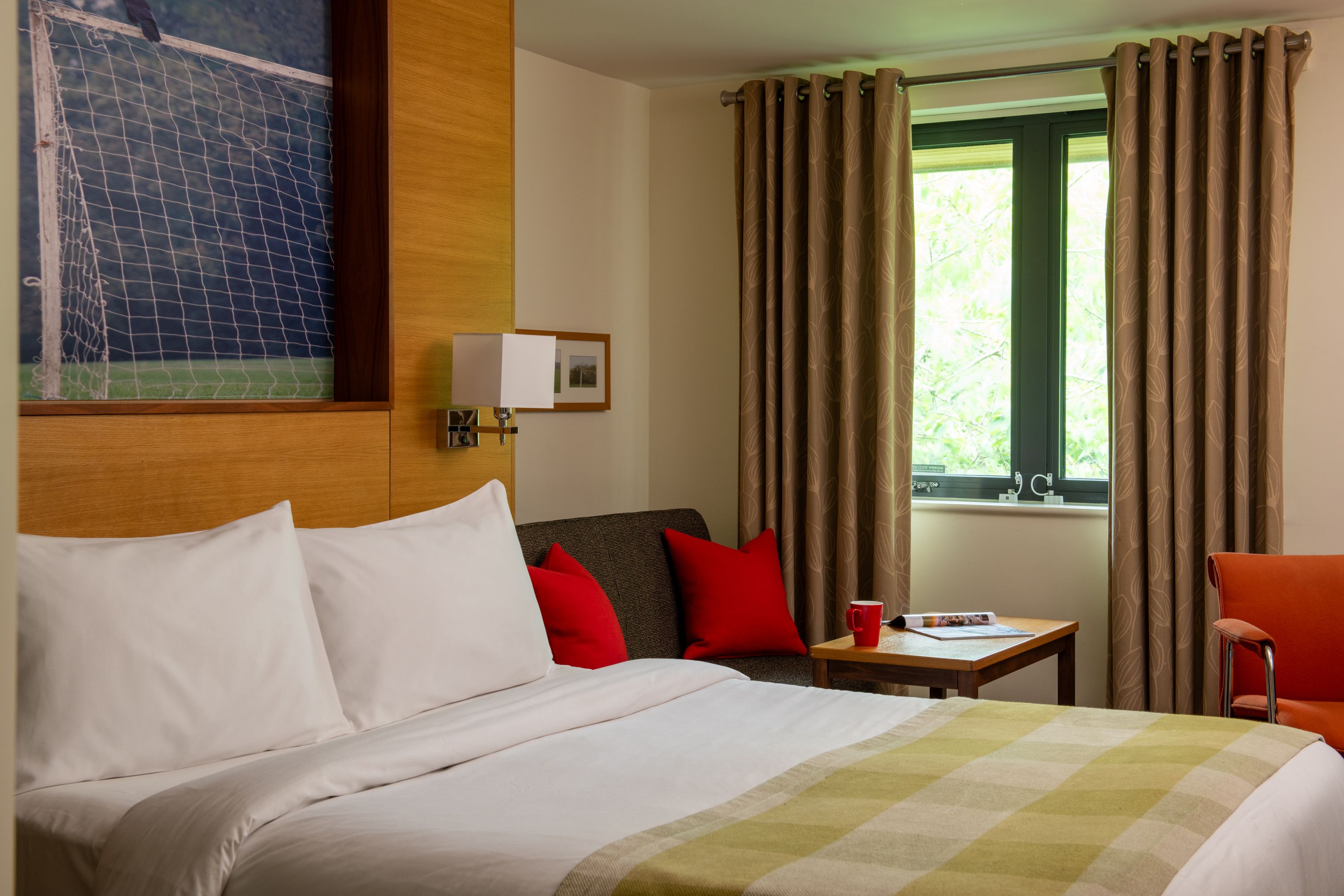 Bed and sofa in lodge bedroom