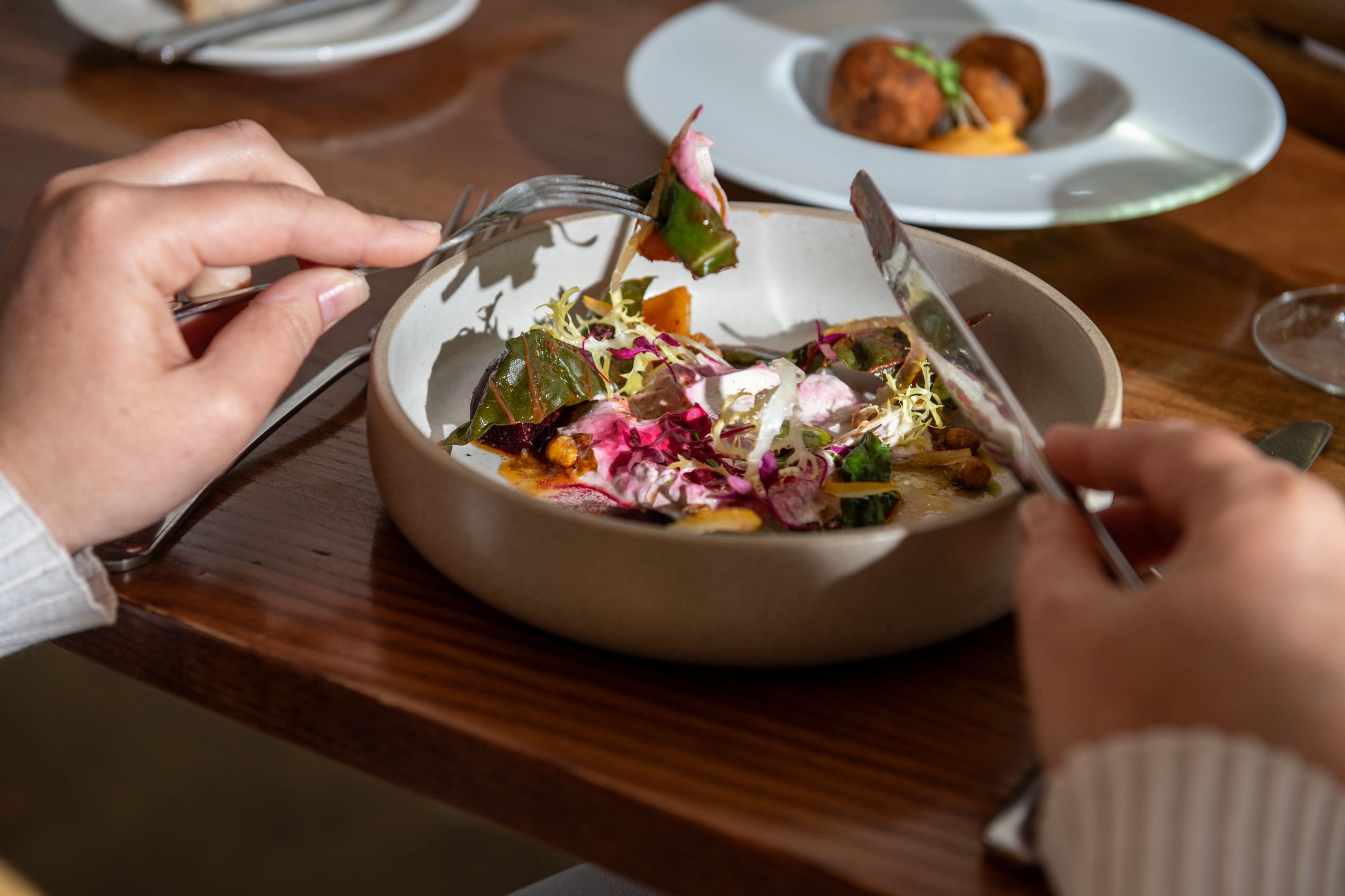 Point of view of lady eating salad